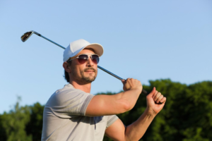 young golfer hitting shot